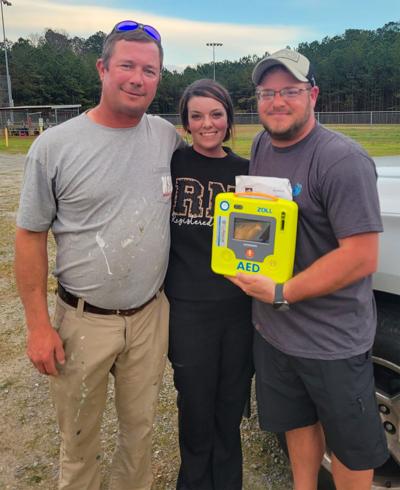 031426 Harpers donate AED.jpg