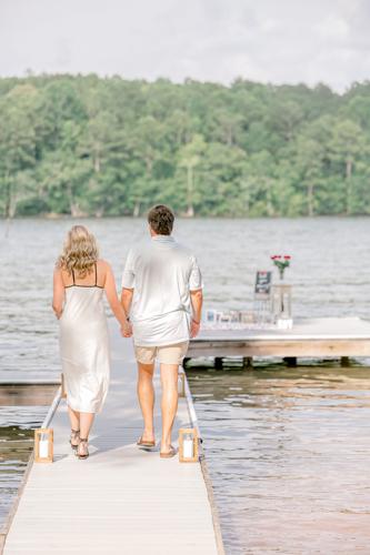 Engagement walking down dock.jpeg