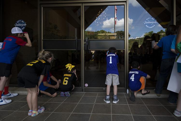 PHOTOS: Children, parents protest for kids to play ball