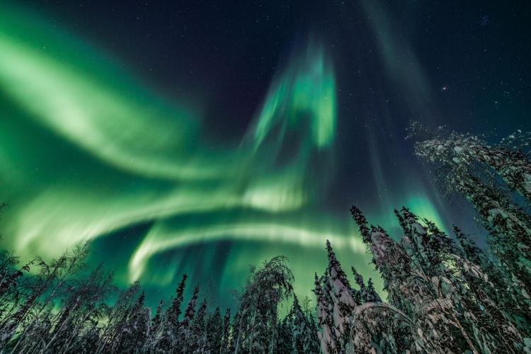 Fall into early winter is a great time for aurora viewing in Alaska. The nights are starting to get longer, but the temperatures are mild. Photo credit: Courtesy of Travel Alaska.