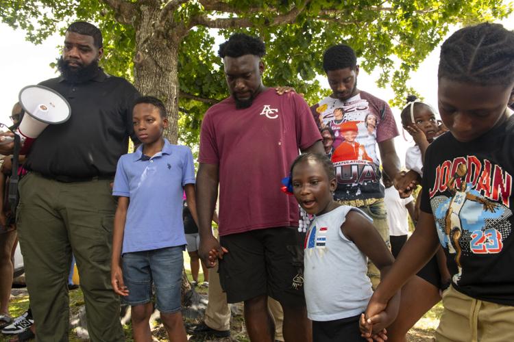 PHOTOS: Residents gather for murder victim and justice