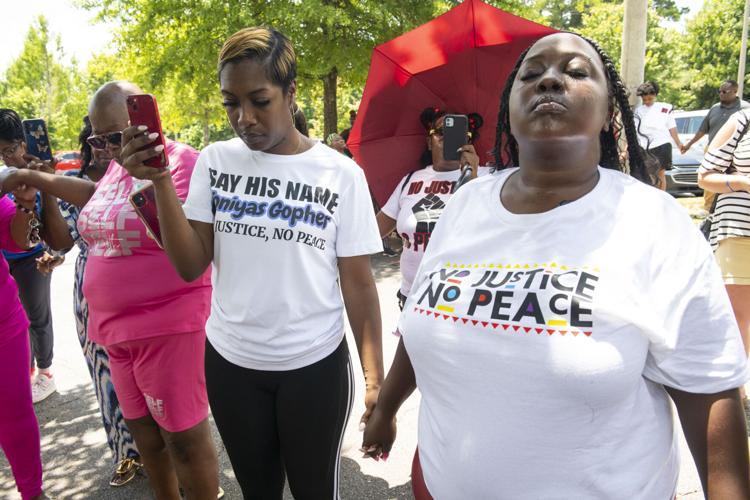 PHOTOS: Residents gather for murder victim and justice