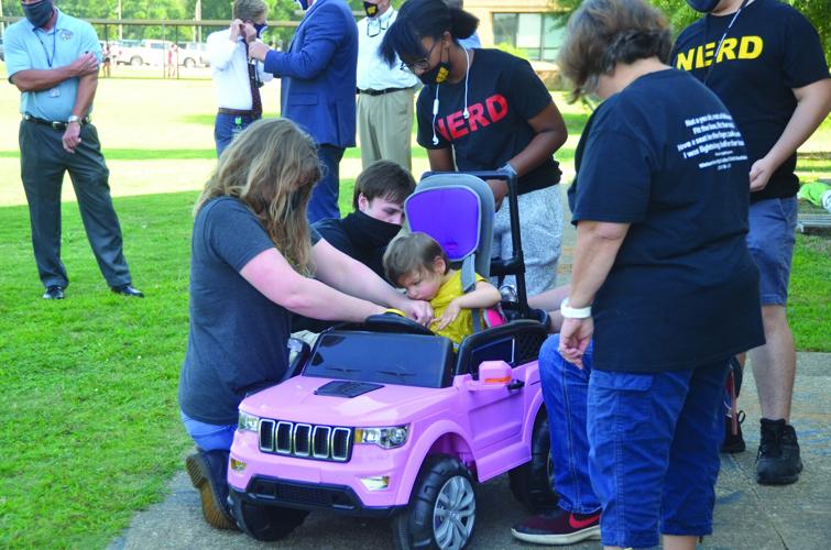 Stella’s got a car: WHS students modify motorized toy car for toddler with disabilities