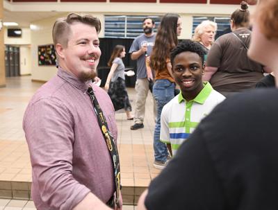 Cliff Williams / TPI Andrew Belk took time to greet everyone who came to the community meeting last week to hear from the new Wetumpka High School band director.