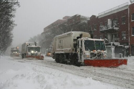 Snow plowing trucks were deployed to clear the streets across New York City