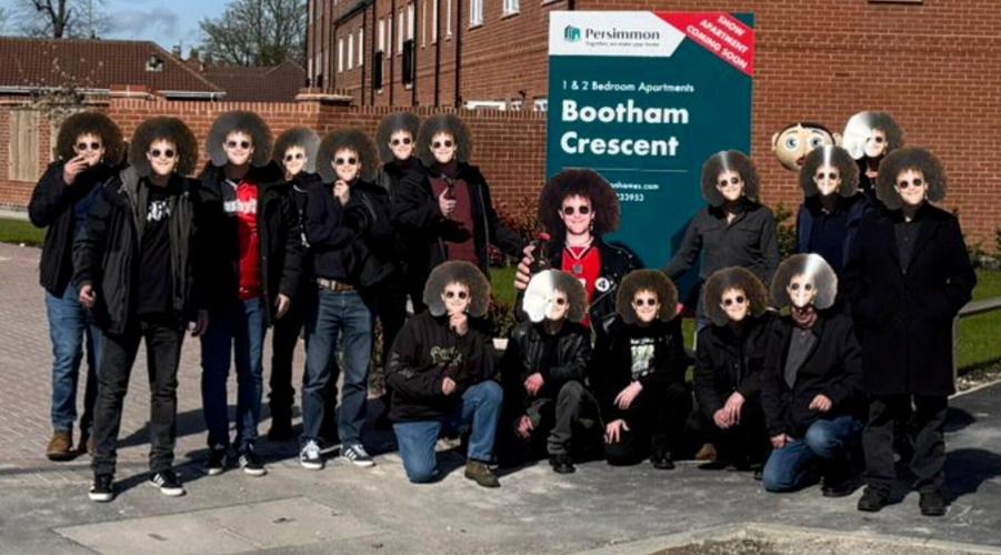 Pals wear masks of late mate’s face at match in tribute to fan after death