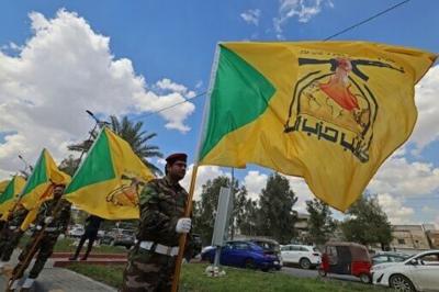 Members of Iraq's pro-Iran paramilitary group Kataeb Hezbollah mourn a comrade who was killed in a strike in Basra, during the funeral in Baghdad on April 8, 2026