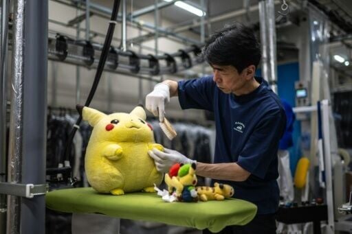 Dry-cleaning professional Masakazu Shimura brushes a soft toy at the facility of Cleaning Yonmarusan in Fuefuki city of Yamanashi Prefecture on April 27, 2026