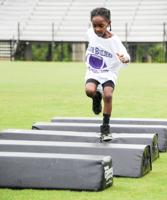PHOTOS: Auburn players visit Bridge Builders youth football camp in Alex City