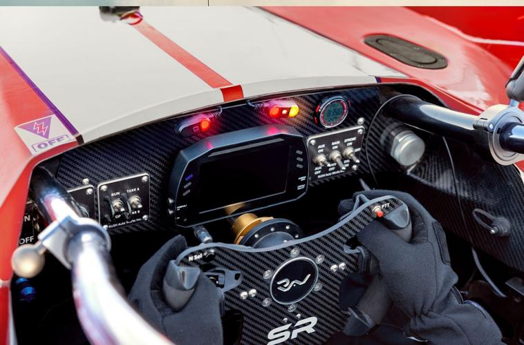 Innovative auto racing radar system provides visual alerts for approaching vehicles to improve awareness and support defense performance.