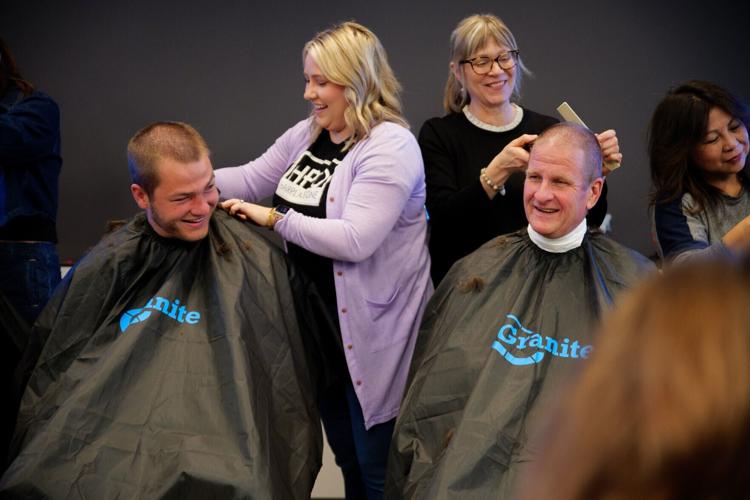 Drake Maye, quarterback of the New England Patriots, joins Rob Hale, CEO of Granite Telecommunications, in shaving his head to raise funds for Boston Children’s Hospital during Granite’s 13th annual Saving by Shaving fundraiser.