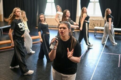 Musical theatre students rehearse the play 'Six' in a rehearsal room at The BRIT School in Croydon, south London, a state-funded school which has trained such stars Adele and Raye