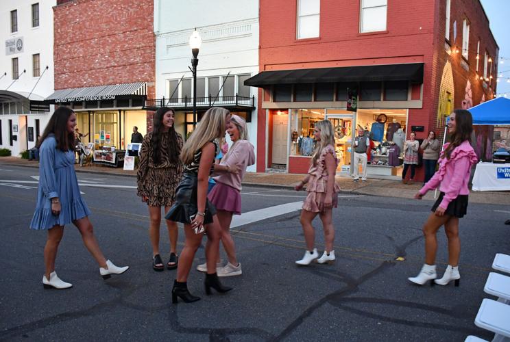 PHOTOS: Models strut down Main Street at 'Sip, Shop and Support'
