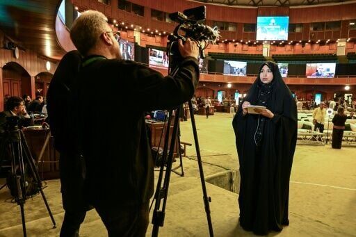 Iranian journalists were seated on the opposite end of the cavernous hall from their US counterparts