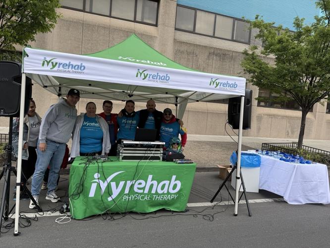 Ivy Rehab Physical Therapy team members cheer on runners at the 2026 Independence Blue Cross Broad Street Run in Philadelphia. Ivy celebrated its fourth year supporting the race and its first as Official Expo Partner.