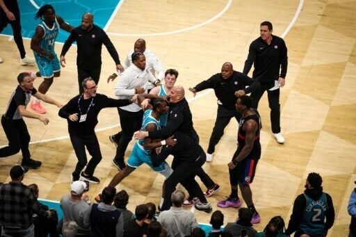 Charlotte's Moussa Diabate (center) is restrained after clashing with Detroit's Miles Bridges in their stormy NBA clash