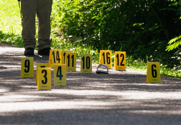 Alexander City police officers work the scene of a shooting on N street