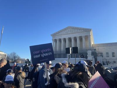 Women's sports advocates outside Supreme Court