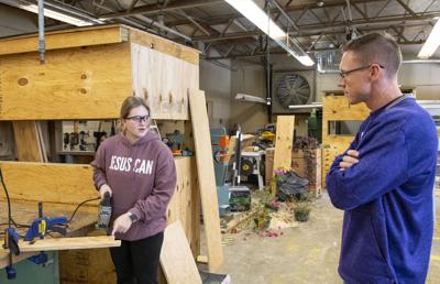 Cliff Williams / TPI Avery Nolin, left, speaks with Dr. Daniel Free in the ag shop at Tallassee High School. Free was selected as FFA Central District Advisor of the Year.
