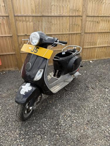 A number plate has sold for 350K – but legally has to come with a broken scooter
