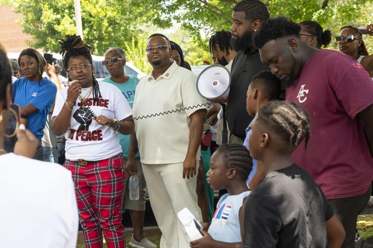 PHOTOS: Residents gather for murder victim and justice