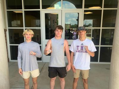 Wrestling trio receives championship rings