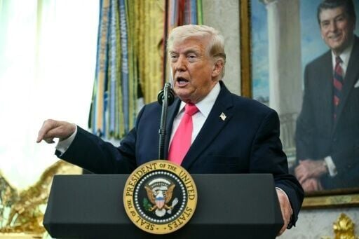 US President Donald Trump, seen here in the Oval Office on March 24, said negotiations with Iran to end the Middle East war were underway "right now"