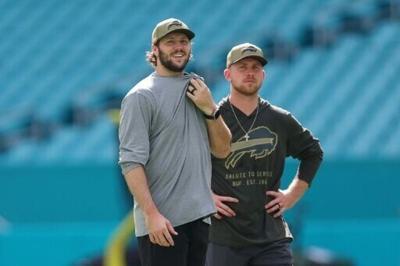 Buffalo Bills quarterback Josh Allen, left, stands alongside Bills offensive coordinator Joe Brady, who agreed on terms of a five-year deal to be the next head coach of the NFL club