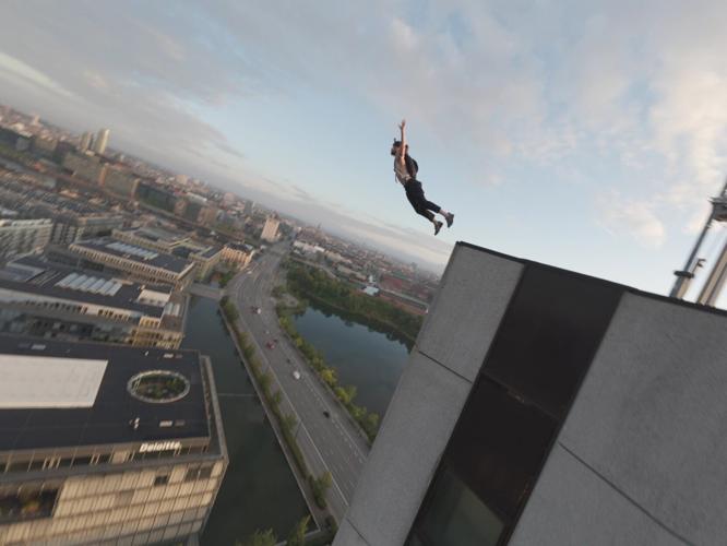 Daredevil scaled 26 storey building and leaped off the top with parachute