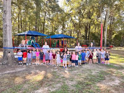 Submitted / TPI Students oof the Wetumpka Child Development Center joined their teachers on the play ground for a ribbon cutting for the center’s new location across from Wetumpka Elementary School.