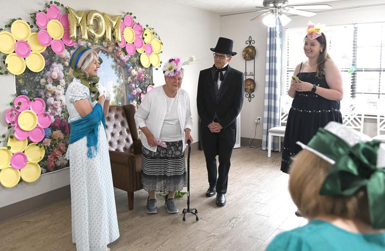 Cliff Williams / TPI Everyone took to the theme and wore hats for the formal Mothers Day Tea at Gardens of Wetumpka Friday. Some residents posed for photos with staff and family.