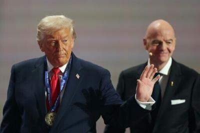 US President Donald Trump leaves the stage after receiving the FIFA peace prize