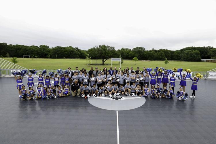 Student athletes and representatives from Genesis, U.S. Soccer Foundation, Dallas Independent School District, and William Anderson Elementary School celebrate the grand opening of the new mini-pitch at William Anderson Elementary School in Dallas on Ap...