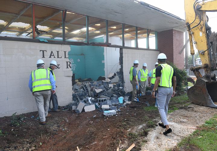Cliff Williams / TPI Elmore County officials join City of Tallassee officials for a razing ceremony at the old Tallassee Parks and Recreation Center. A new 30,000 square foot center is being built at the current location.