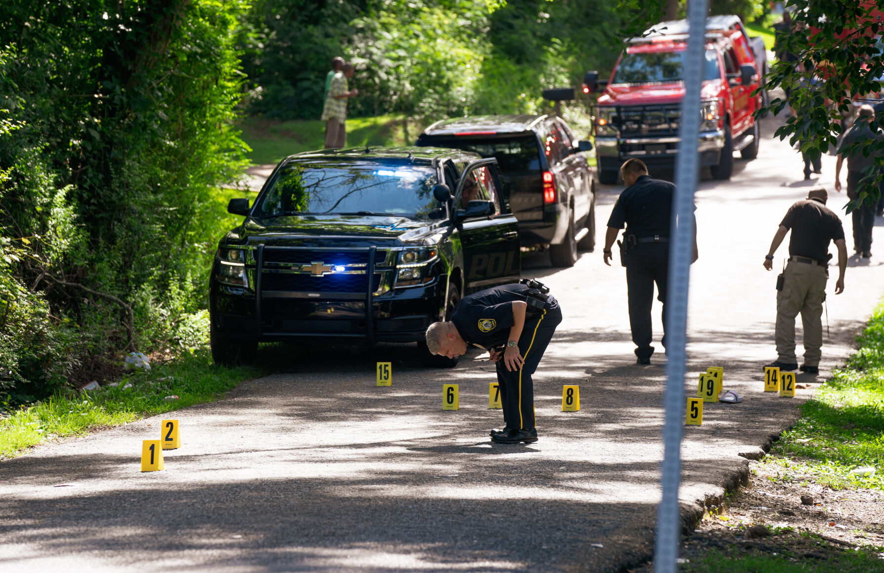 Alexander City police officers work the scene of a shooting on N street