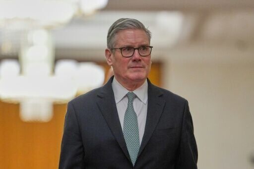 Britain's Prime Minister Keir Starmer walks to his meeting with China's President Xi Jinping at the Great Hall of the People in Beijing on January 29, 2026. Starmer met with China's leader Xi Jinping in Beijing on January 29, state news agency Xinhua re...