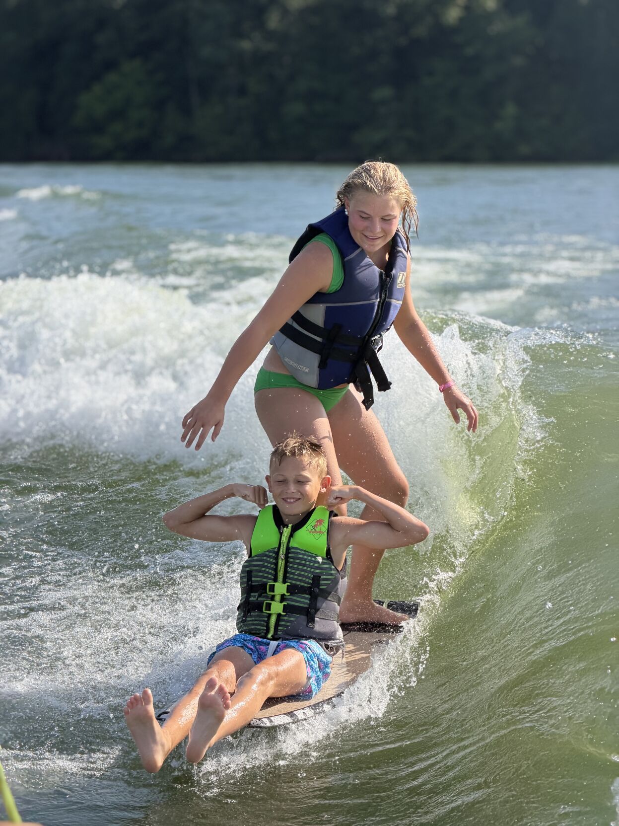 Kate Minix and Rhett Dennis surfing.jpeg