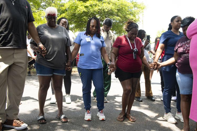 PHOTOS: Residents gather for murder victim and justice
