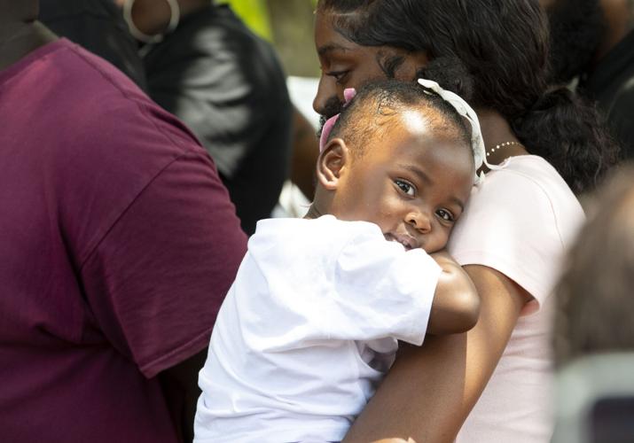 PHOTOS: Residents gather for murder victim and justice