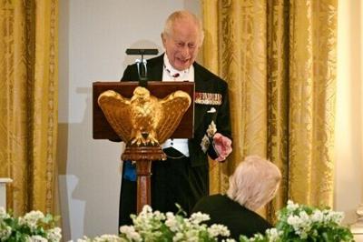 Britain's King Charles III speaks as US President Donald Trump looks on during a State Dinner