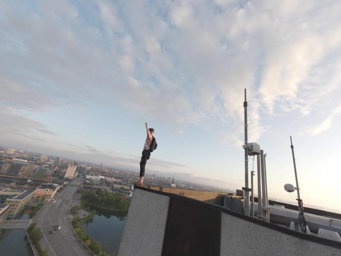 Daredevil scaled 26 storey building and leaped off the top with parachute