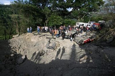 Buses and vans were left mangled in the blast on the Pan-American Highway, in the restive southwestern Cauca department