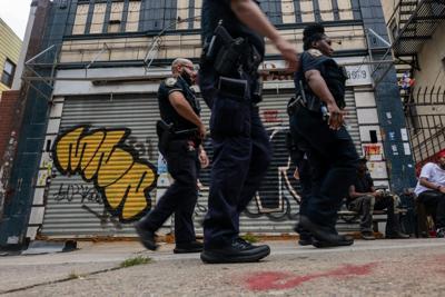 Police patrol Brooklyn’s Crown Heights in New York after a gang-related shooting in August 2025.