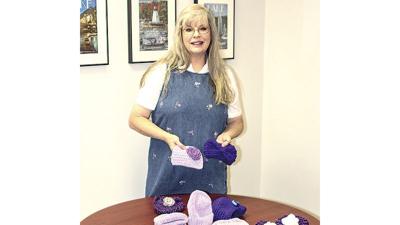 Local ladies make hats with meaning