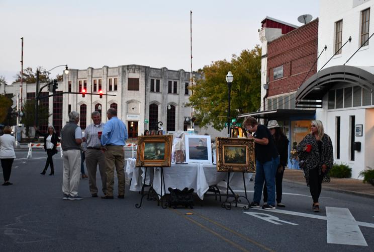 PHOTOS: Models strut down Main Street at 'Sip, Shop and Support'