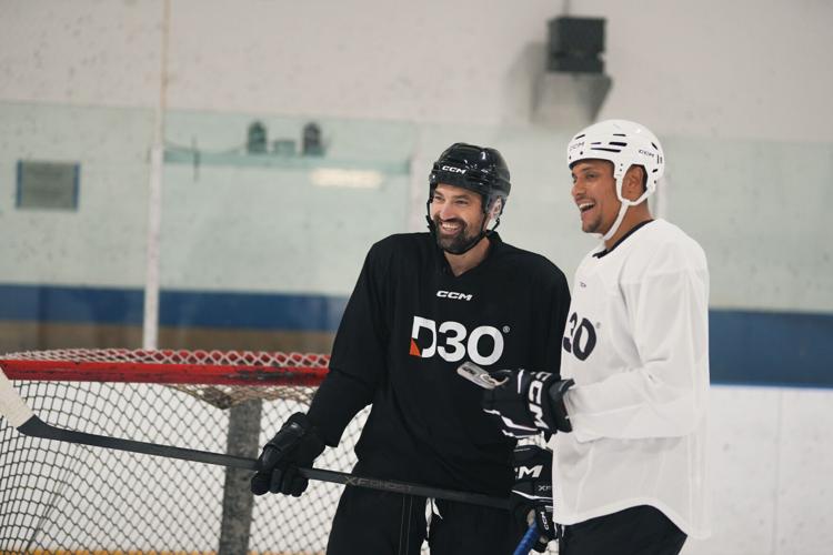 NHL Pro Hockey player Dakota Joshua and How to Hockey's Coach Jeremy, testing out D3O protected phone cases on the ice at Upper Canada College.