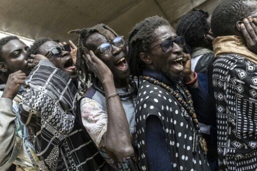 Baye Fall followers perform repetitive recitations of prayers