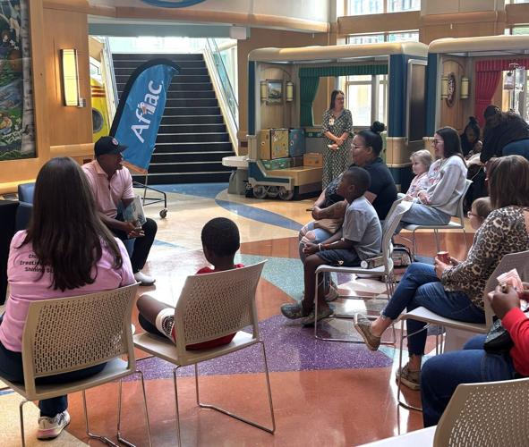 Brian Jordan, former Major League Baseball, NFL football star and Chairman and CEO of the Brian Jordan Foundation, reads a children's book he wrote to patients at SSM Health Cardinal Glenn Children's Hospital in St. Louis, where he played for 7 years du...