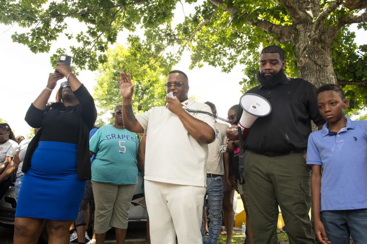 PHOTOS: Residents gather for murder victim and justice