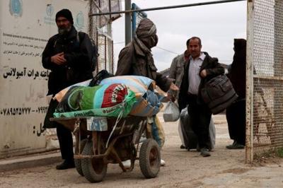 Afghan in Iran must decide between war there or war in their home nation